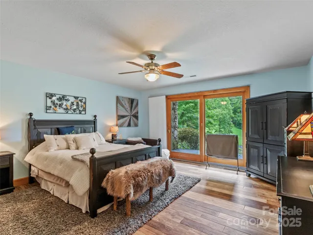 a bed room with a bed and a large window