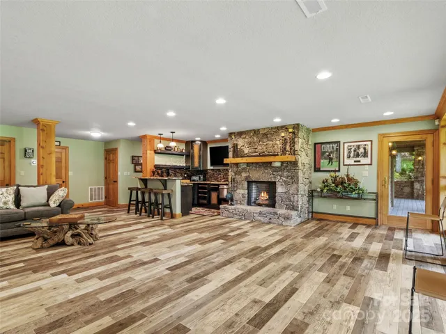 a room with lots of furniture and a fireplace