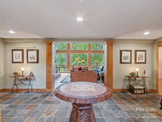 a living room with furniture and a table