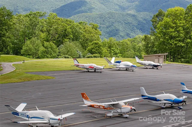 a view of lawn chairs and an umbrella