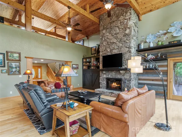 a living room with fireplace furniture and a fireplace