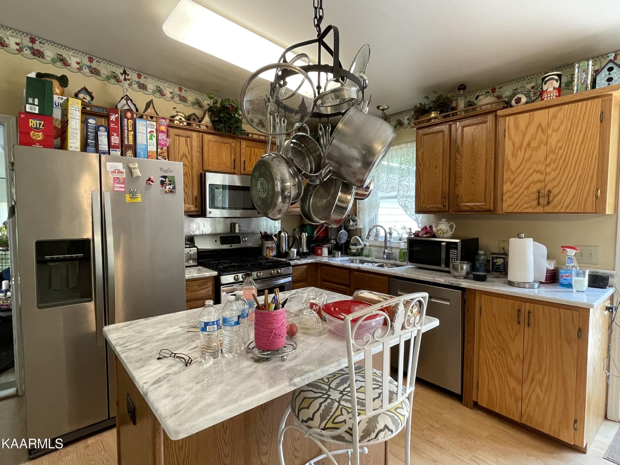 330 Deerfield Road Sparta, TN 38583 - Photo 16 of 32 a kitchen with stainless steel appliances granite countertop a sink dishwasher and refrigerator with wooden floor