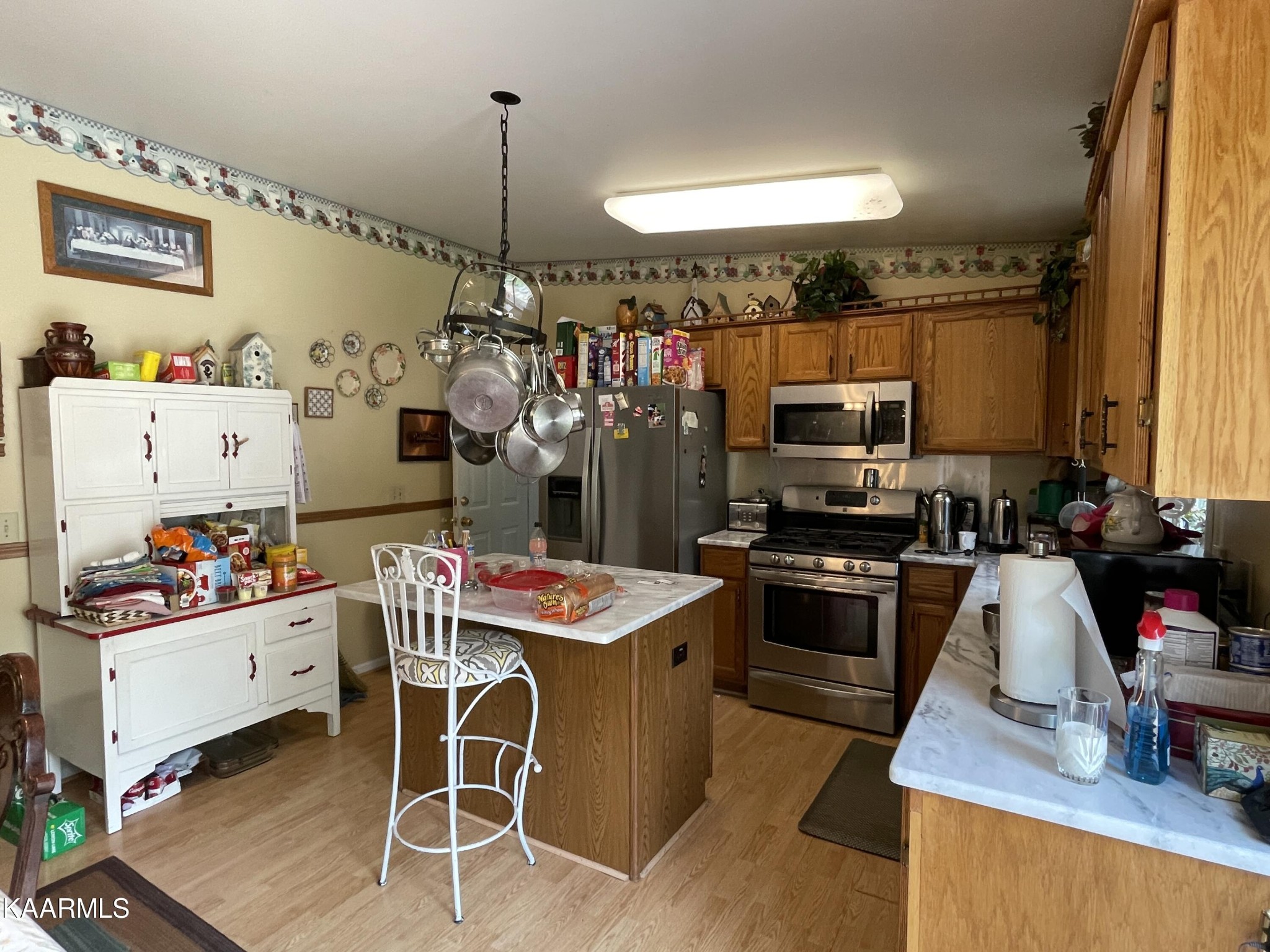 330 Deerfield Road Sparta, TN 38583 - Photo 17 of 32 a kitchen filled with stainless steel appliances kitchen island granite countertop a sink dishwasher and a stove with wooden floor