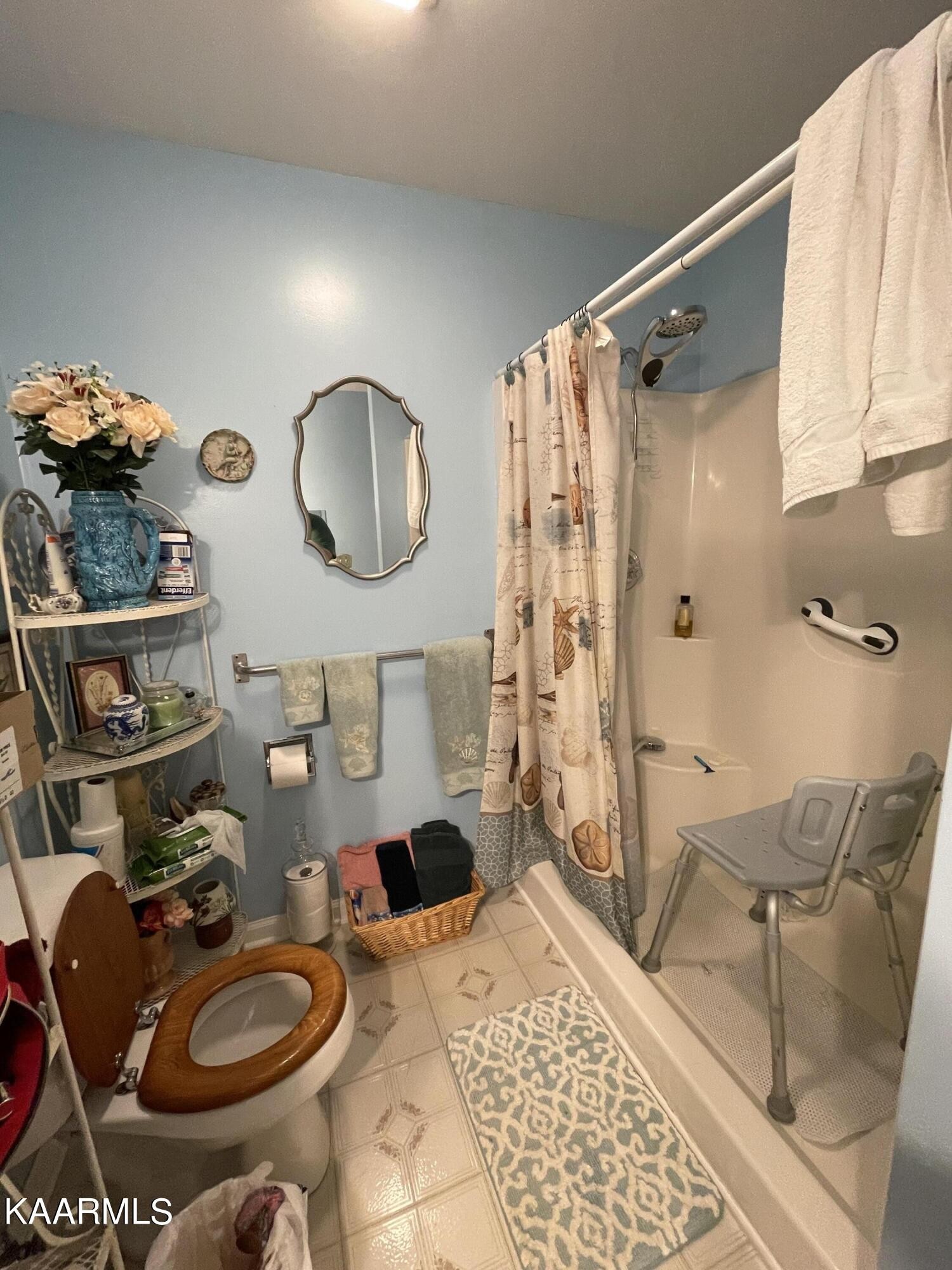 330 Deerfield Road Sparta, TN 38583 - Photo 23 of 32 a bathroom with a sink mirror vanity and toilet
