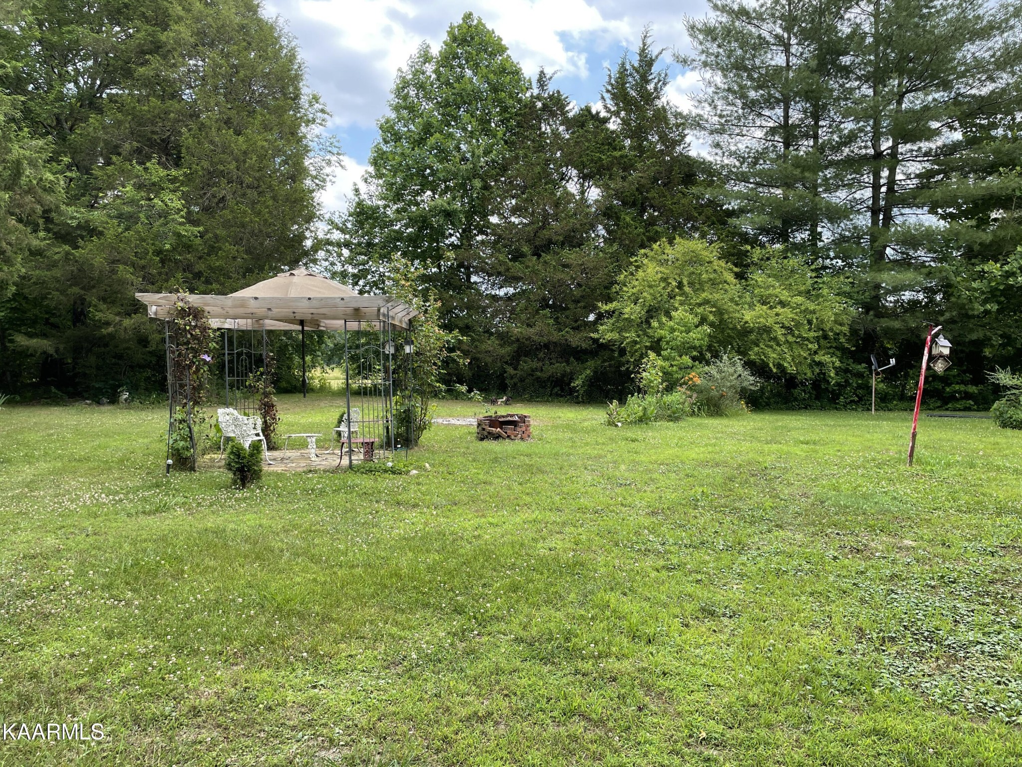 330 Deerfield Road Sparta, TN 38583 - Photo 32 of 32 a view of a park with large trees and a slide