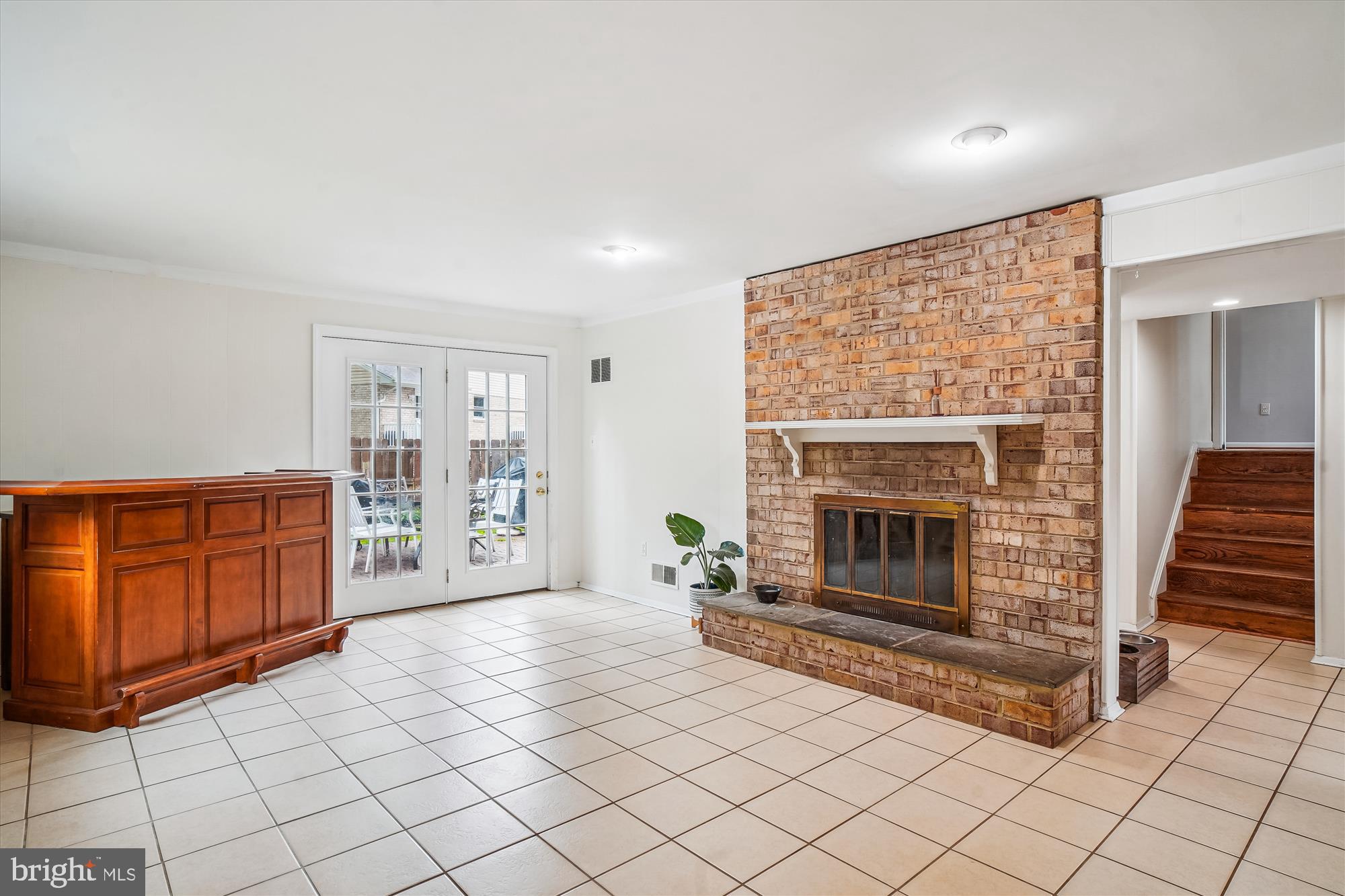 18704 Bloomfield Road Olney, MD 20832 - Photo 25 of 52 Family room with fireplace and walkout to patio