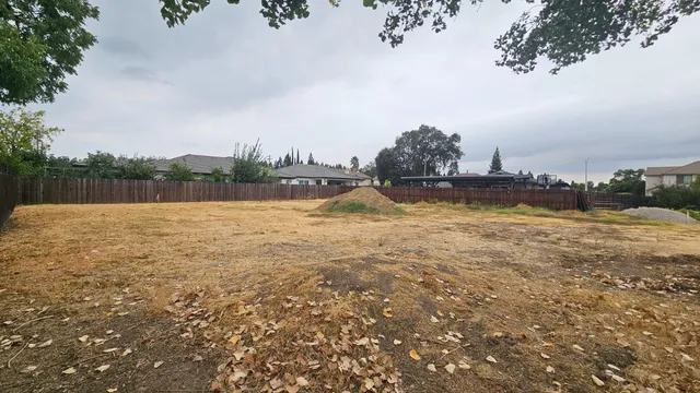 a view of a lake with houses in the back