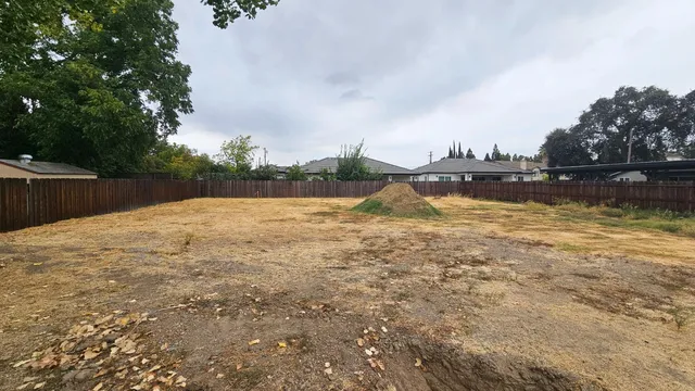 a view of a lake with houses in the back
