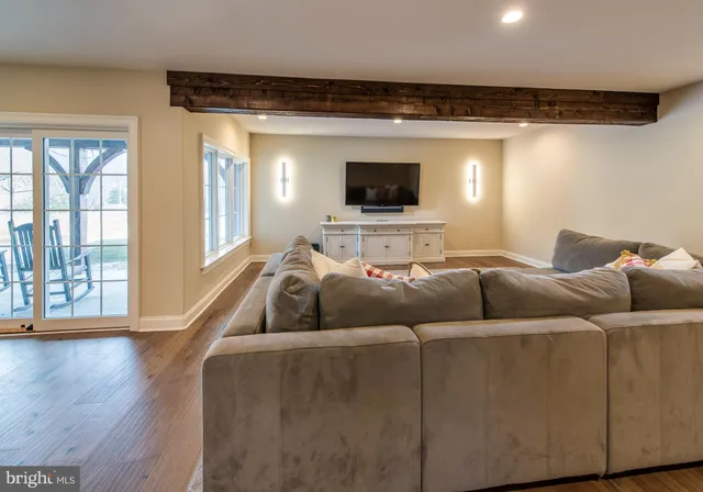 a spacious bathroom with a granite countertop tub sink shower and a mirror