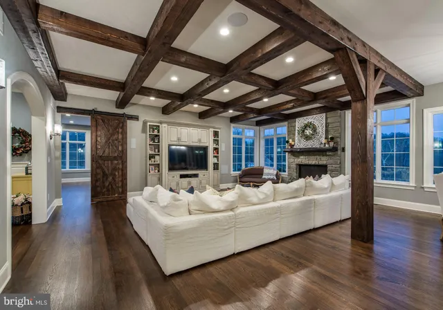 a view of an entryway with wooden floor
