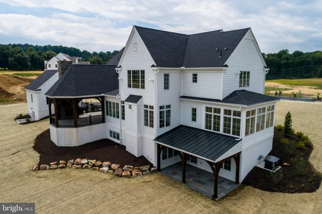 a view of a terrace with couches and sky view