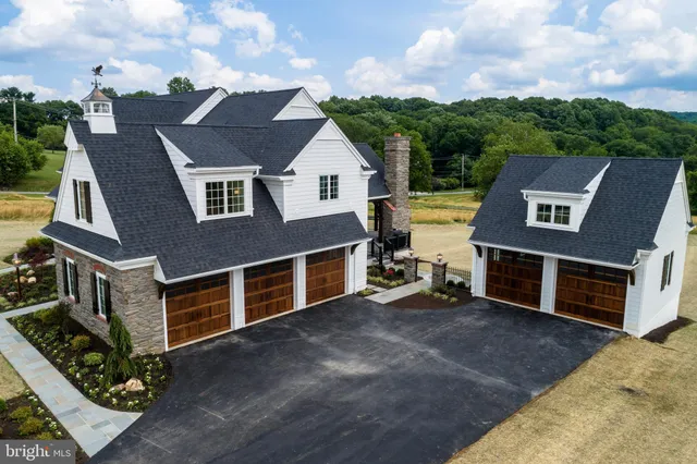 swimming pool view with a seating space
