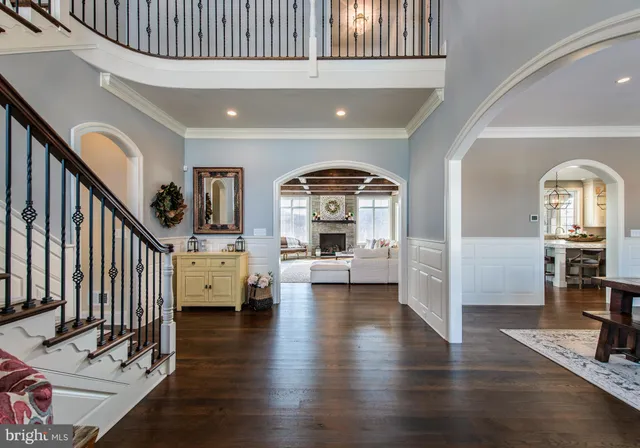 a view of livingroom with furniture staircase and kitchen view