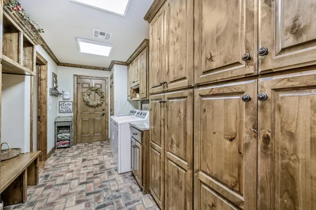 a view of a hallway with wooden floor and windows