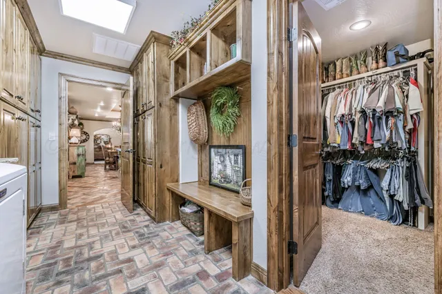a living room with furniture a wooden floor and ceiling window
