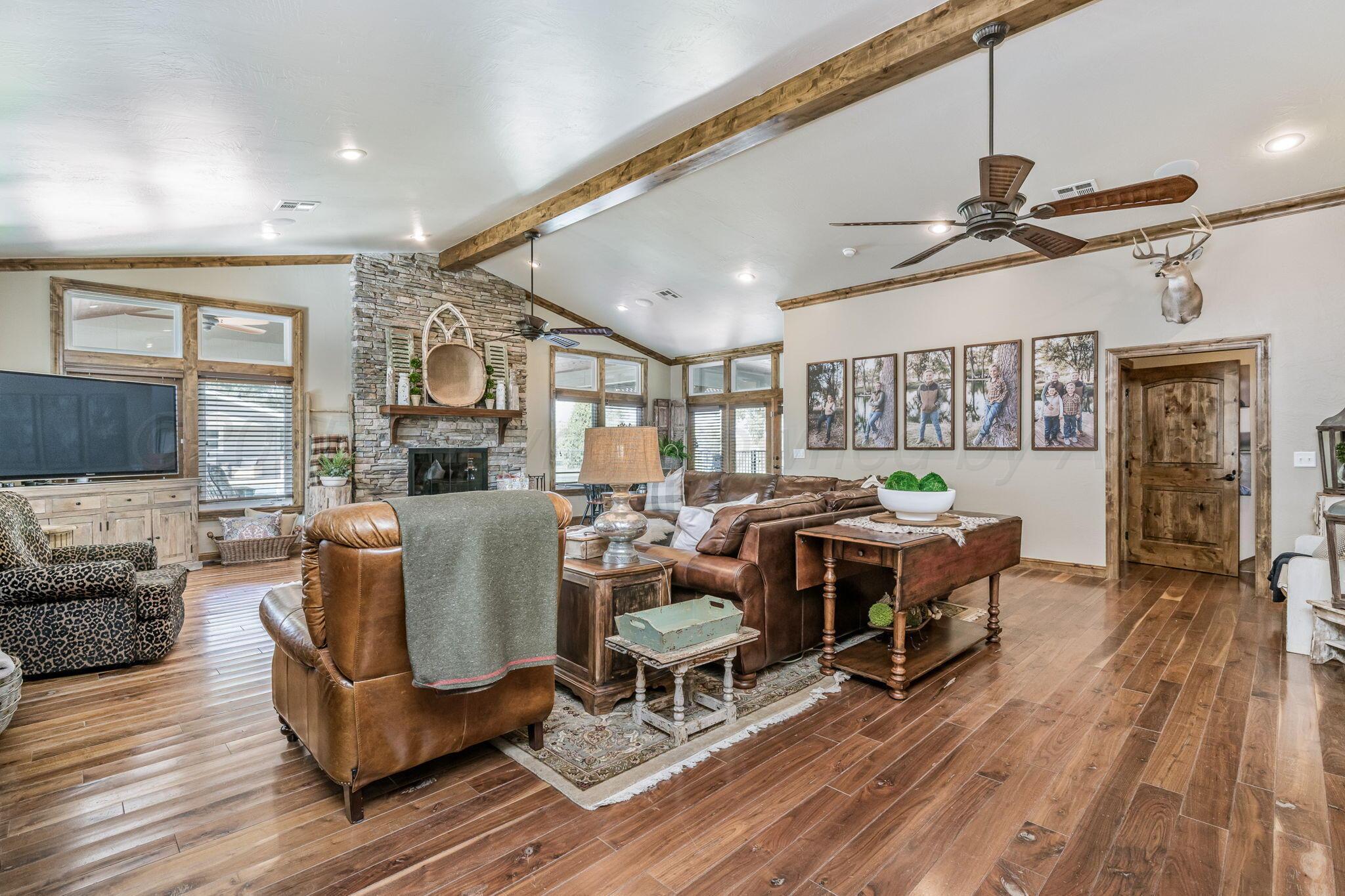 100 Thomas Lane Wheeler, TX 79096 - Photo 13 of 50 a living room with furniture a wooden floor and ceiling window