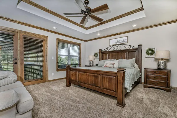 a bed room with a bed and a chair