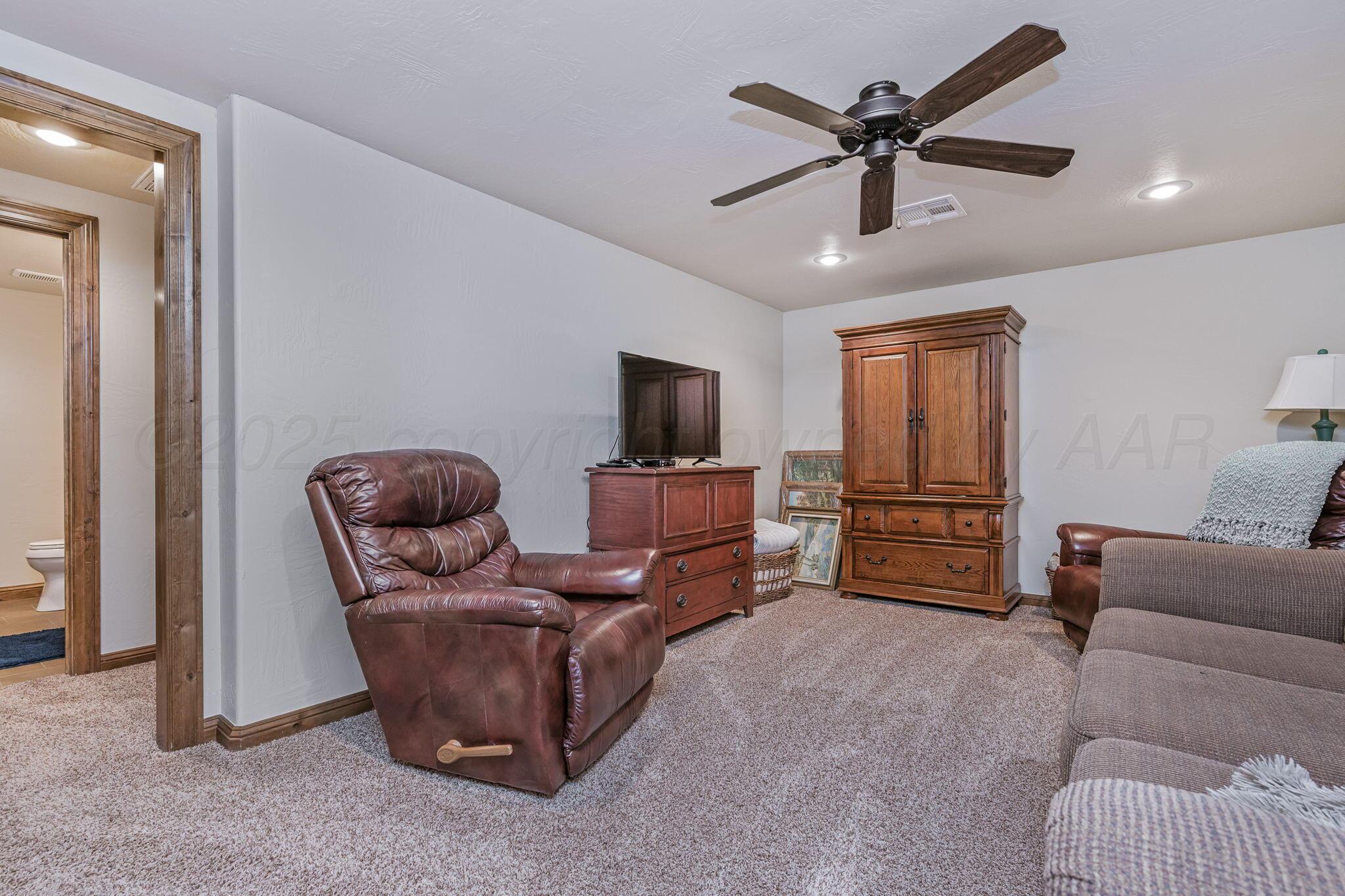 100 Thomas Lane Wheeler, TX 79096 - Photo 24 of 50 a living room with furniture and a flat screen tv