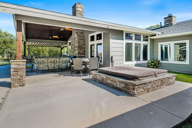 a front view of a house with outdoor seating