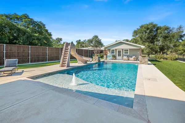 a view of a house with a swimming pool