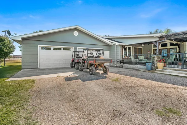 a front view of a house with outdoor seating