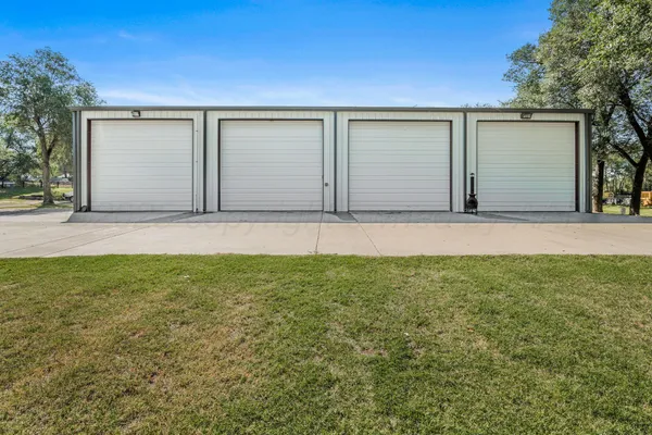a view of backyard with garage