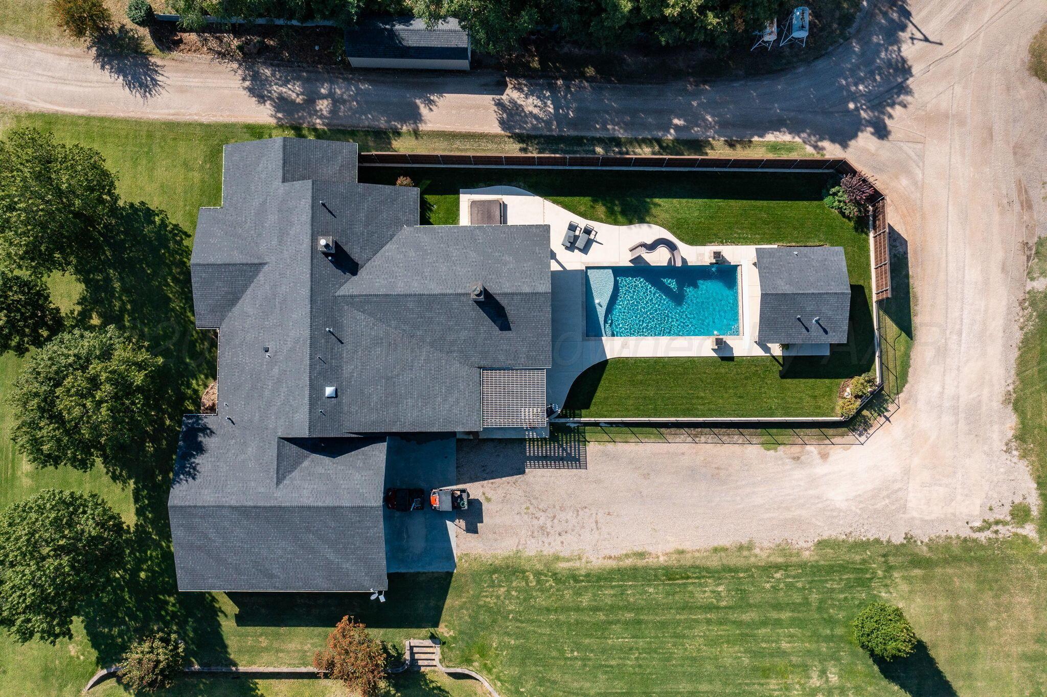 100 Thomas Lane Wheeler, TX 79096 - Photo 47 of 50 an aerial view of a house with a garden and lake view
