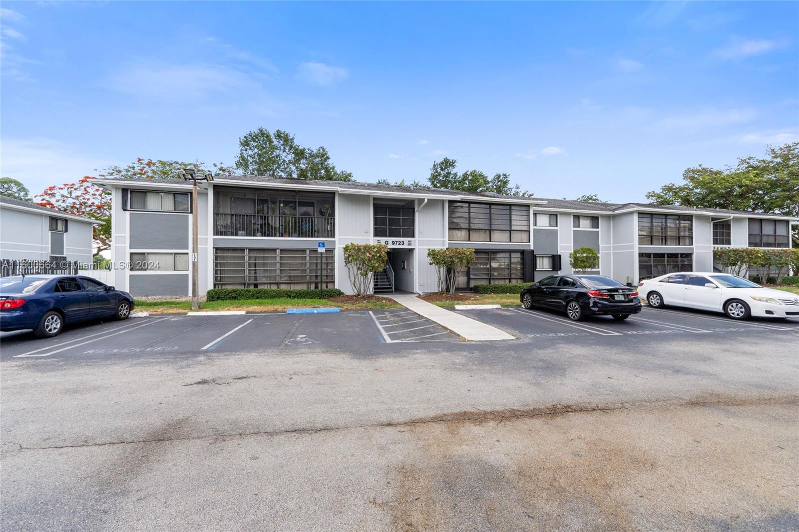 9723 Hammocks Boulevard, Unit 202 Miami, FL 33196 - Photo 14 of 15 a view of street with parked cars