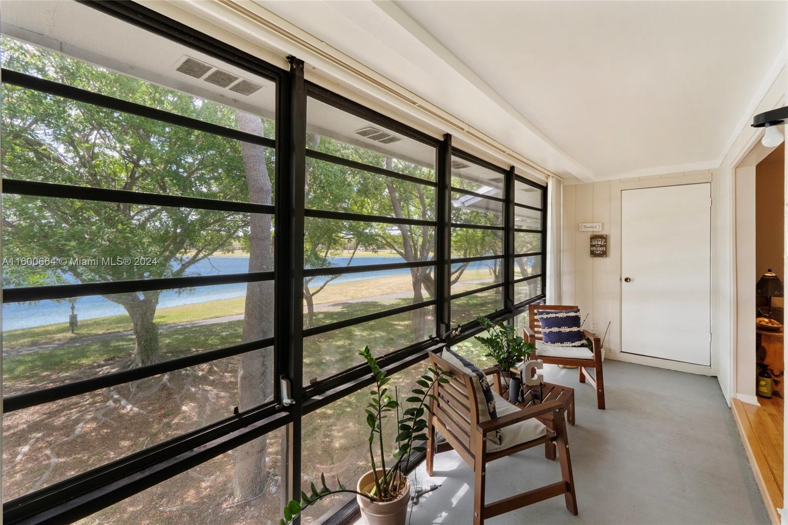 9723 Hammocks Boulevard, Unit 202 Miami, FL 33196 - Photo 6 of 15 a view of a room with lounge chair