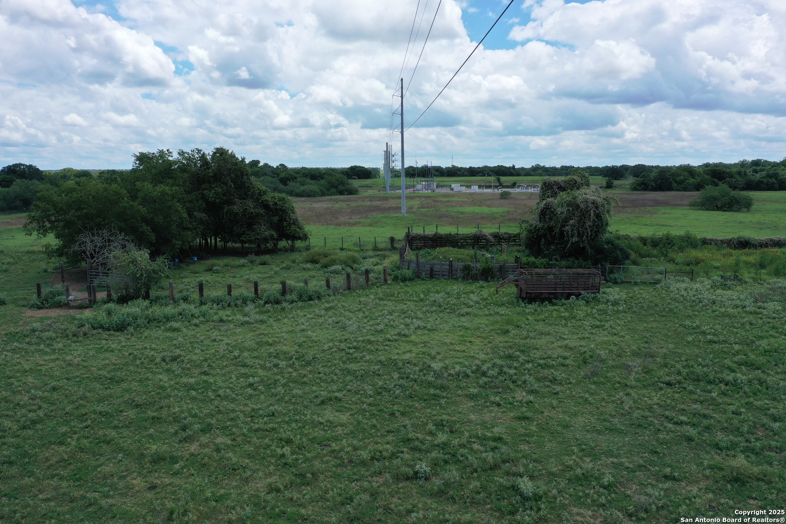 0 County Rd 240 Harwood, TX 78632 - Photo 6 of 34 a view of a green field with wooden fence