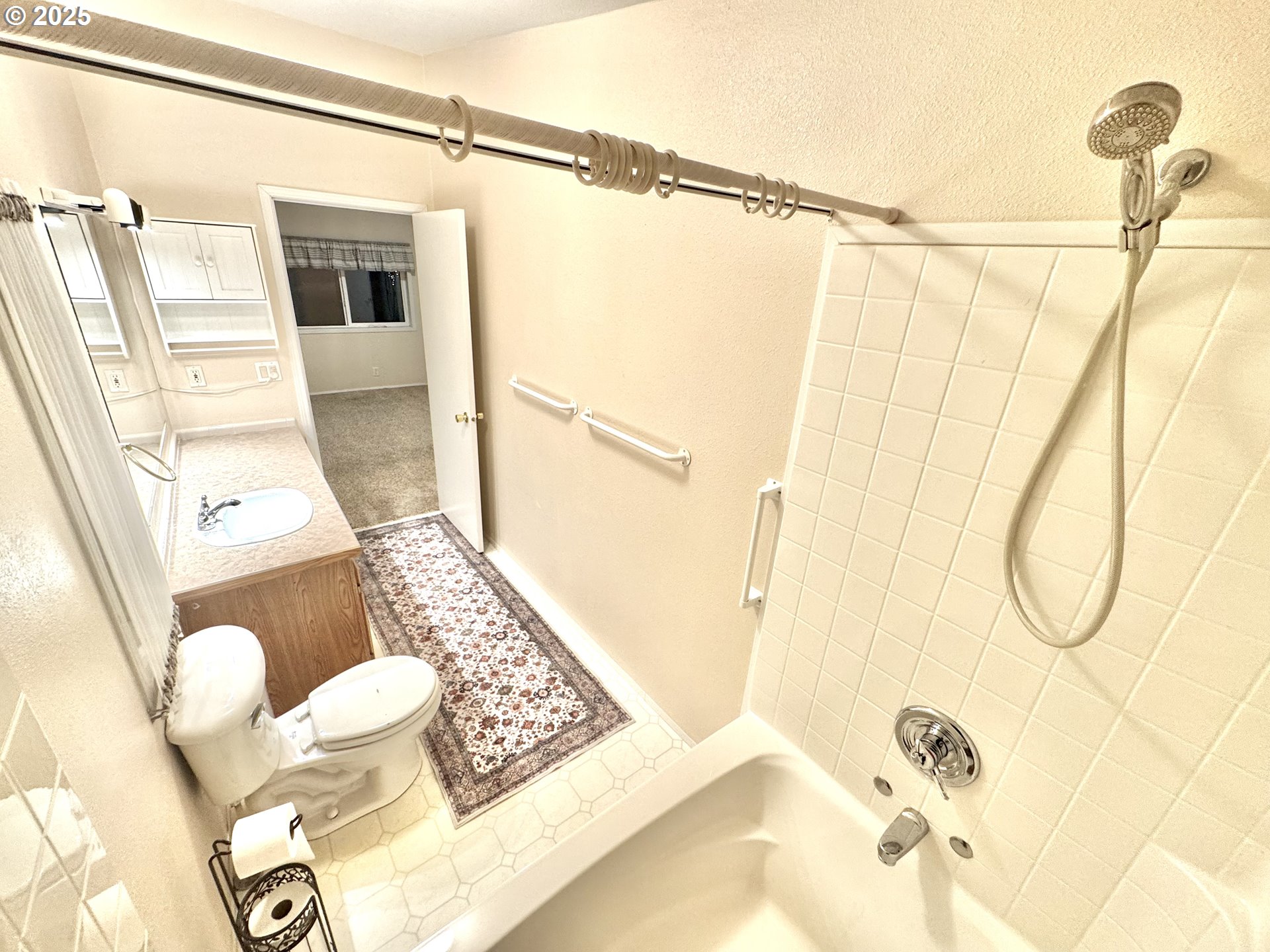 185 North 3rd Street Lakeside, OR 97449 - Photo 15 of 45 a bathroom with a sink and shower