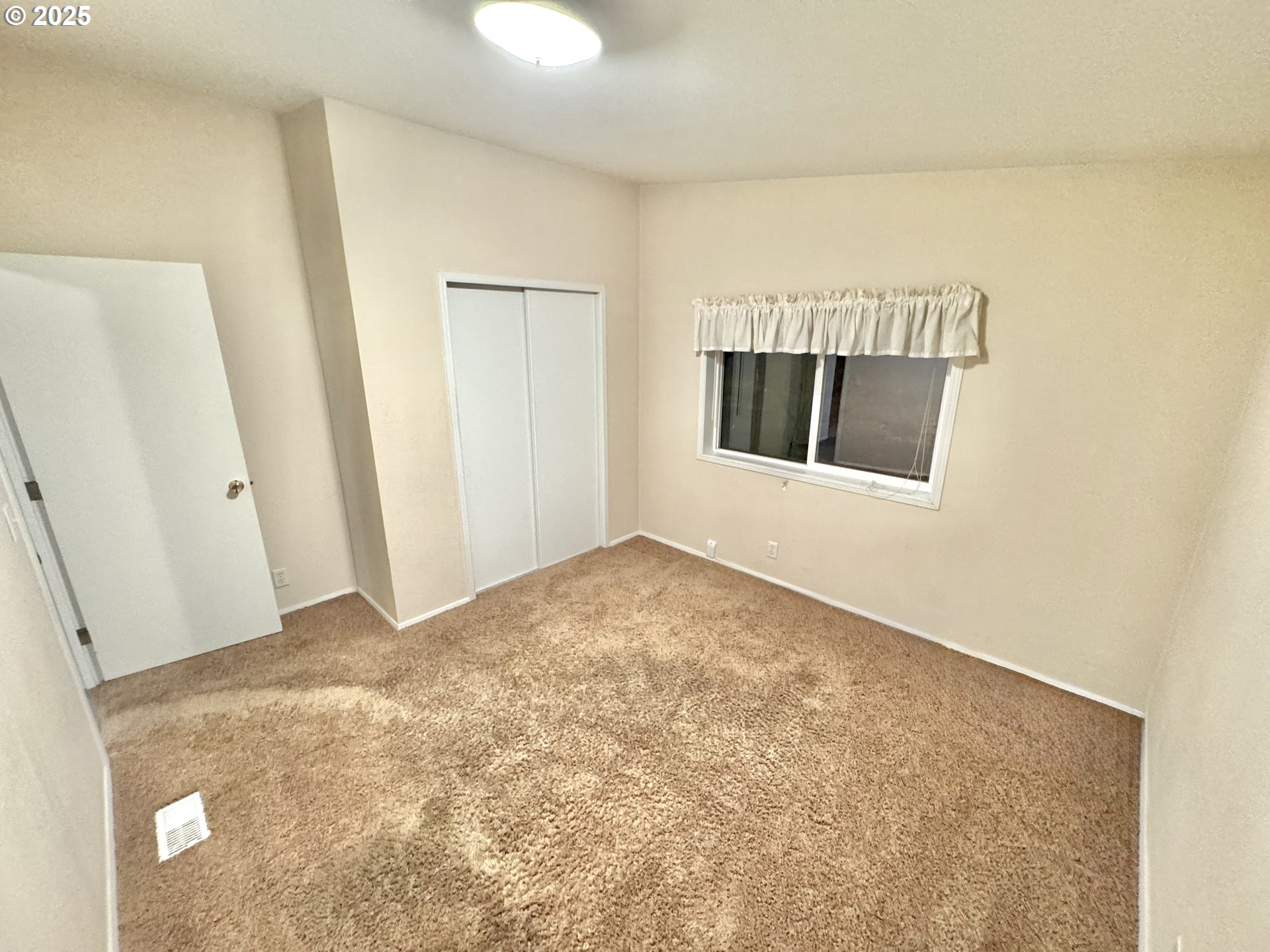 185 North 3rd Street Lakeside, OR 97449 - Photo 16 of 45 a view of an empty room with a fireplace