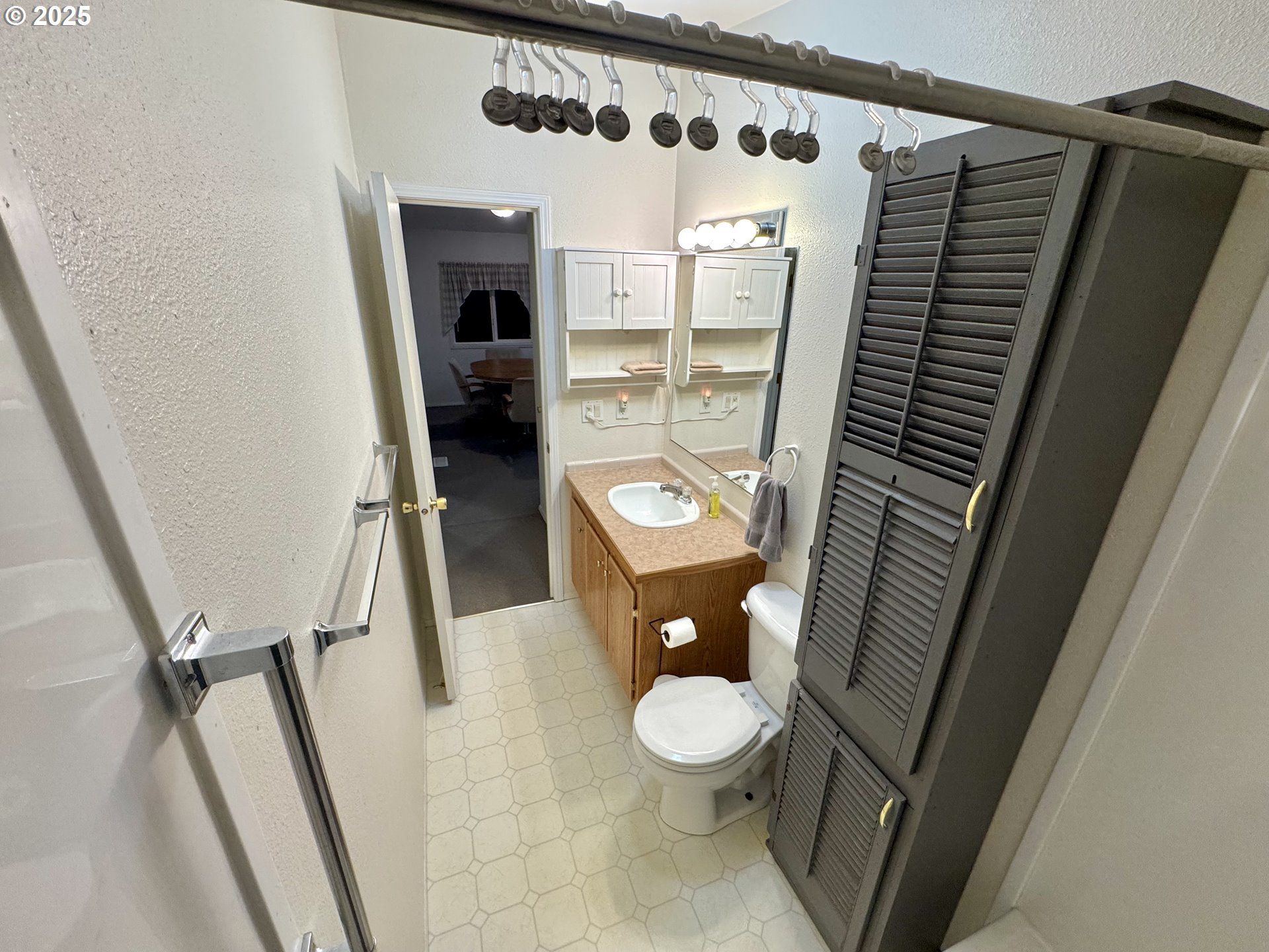 185 North 3rd Street Lakeside, OR 97449 - Photo 19 of 45 a bathroom with a toilet and a shower