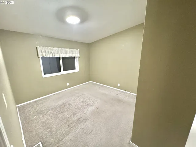 an empty room with a bathroom