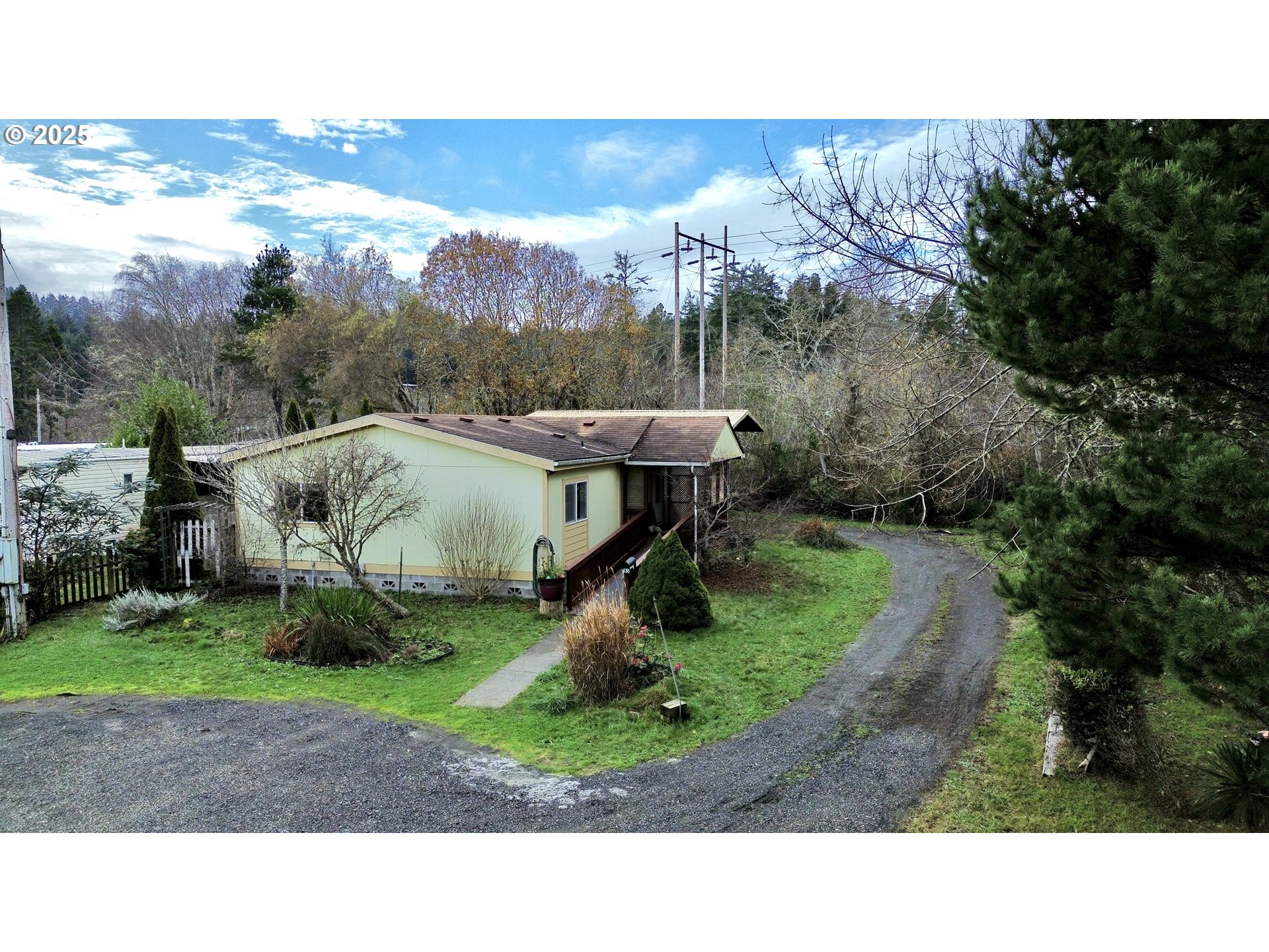 185 North 3rd Street Lakeside, OR 97449 - Photo 30 of 45 a backyard of a house with yard and outdoor seating