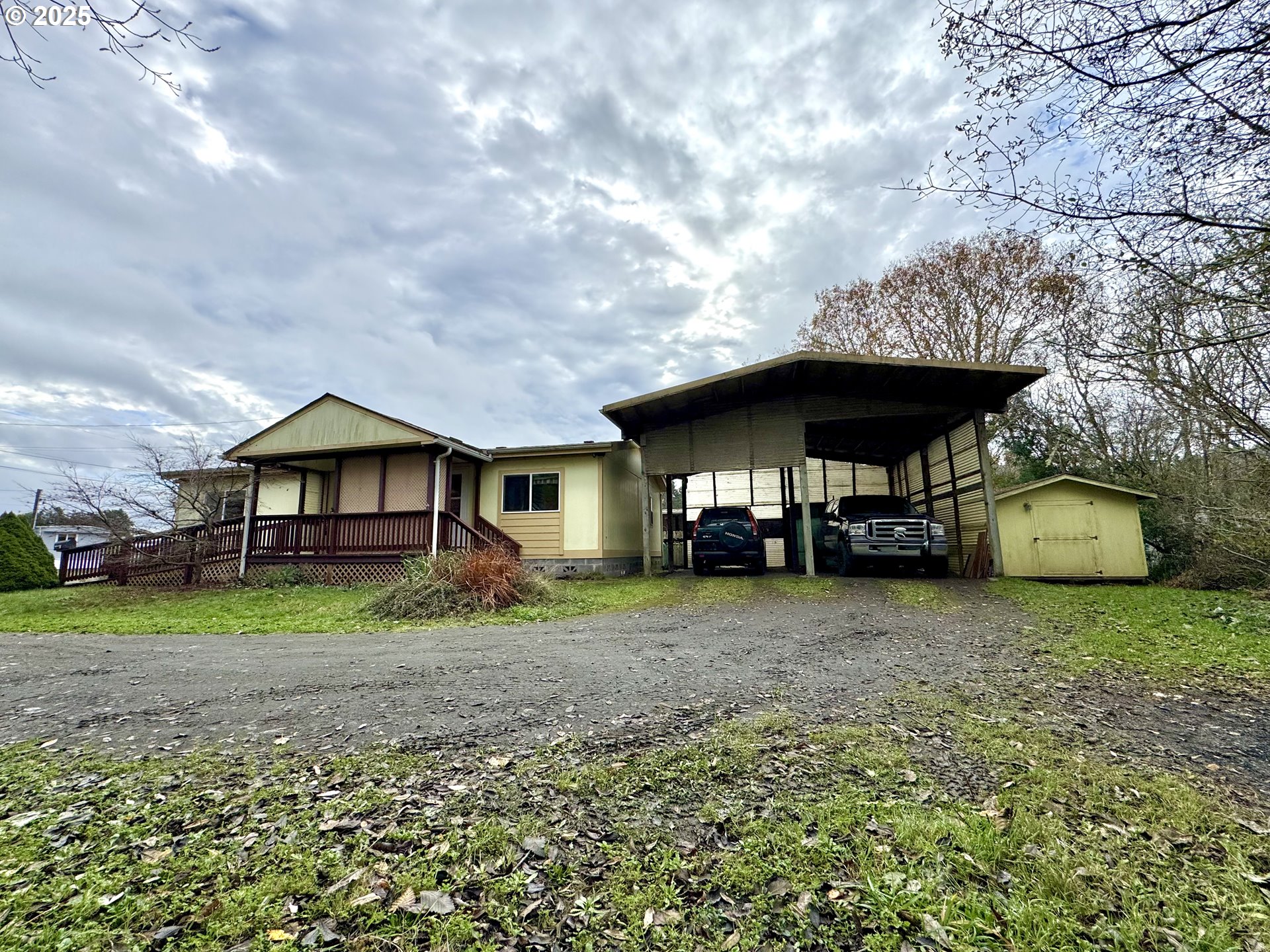 185 North 3rd Street Lakeside, OR 97449 - Photo 33 of 45 a front view of a house with garden