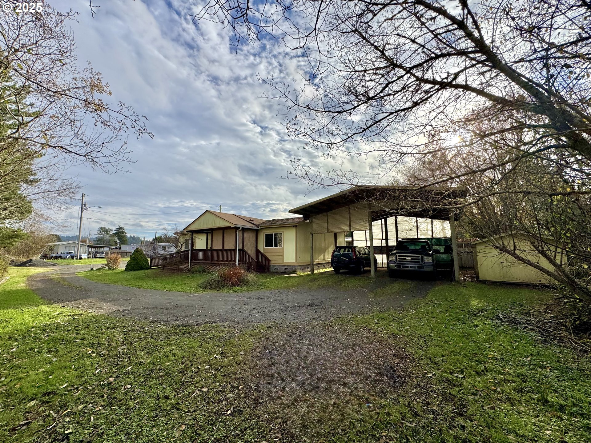185 North 3rd Street Lakeside, OR 97449 - Photo 34 of 45 a view of a house with a yard