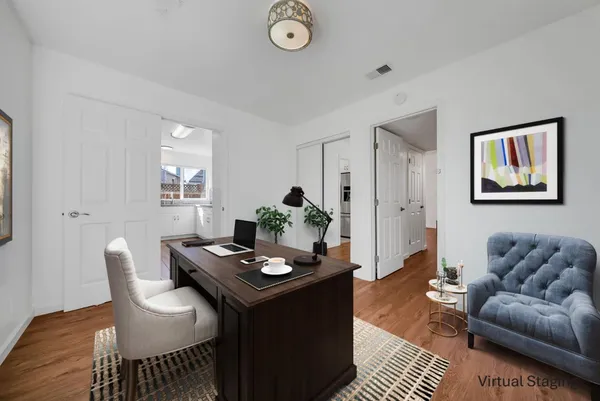 a living room with furniture and a table
