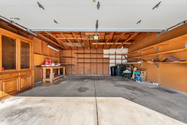a view of a garage with an outdoor space