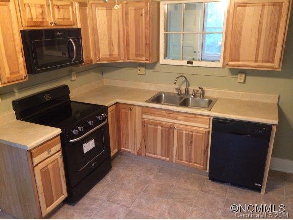 34 Sayles Road Asheville, NC 28803 - Photo 2 of 6 a kitchen with a sink stove and microwave
