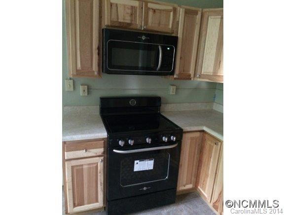 34 Sayles Road Asheville, NC 28803 - Photo 3 of 6 a kitchen with a stove and microwave