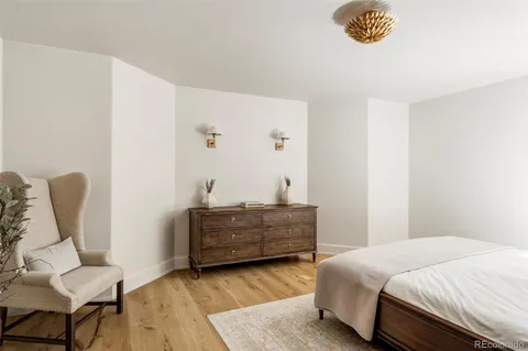 a bedroom with a bed and a cabinets
