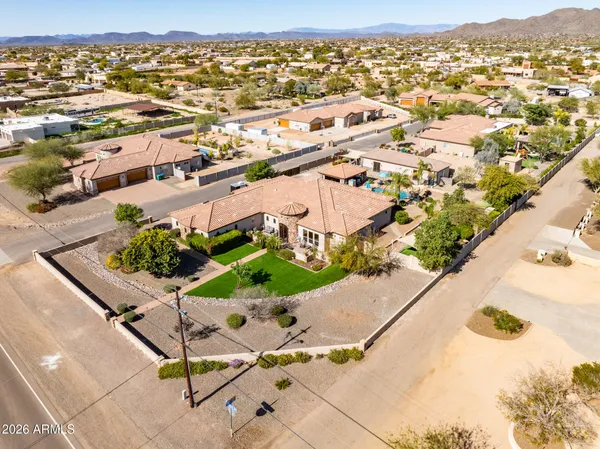 an aerial view of residential houses with outdoor space