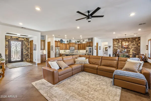 a living room with furniture fireplace and a flat screen tv