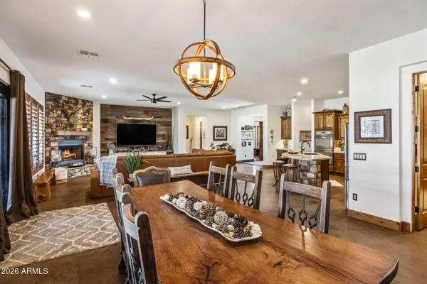 a very nice looking dining room with furniture window and outside view
