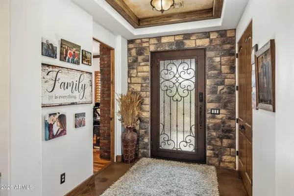 a kitchen with stainless steel appliances granite countertop a sink and a refrigerator