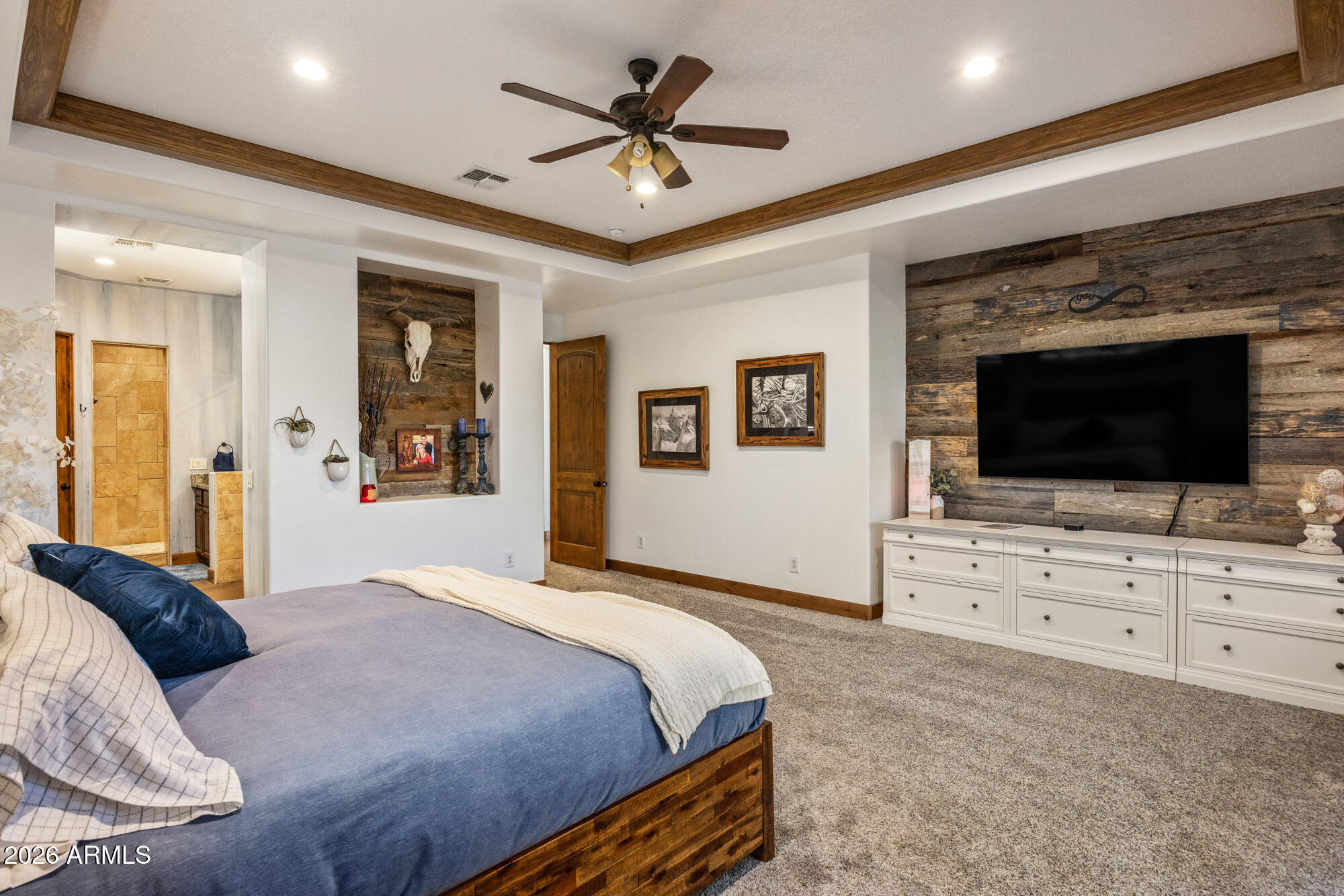 1406 West Joy Ranch Road Phoenix, AZ 85086 - Photo 28 of 58 a bedroom with a bed and a flat screen tv