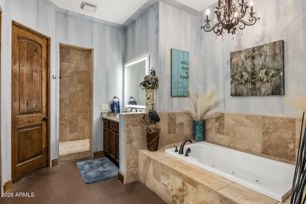 a bathroom with a granite countertop toilet a sink and a mirror