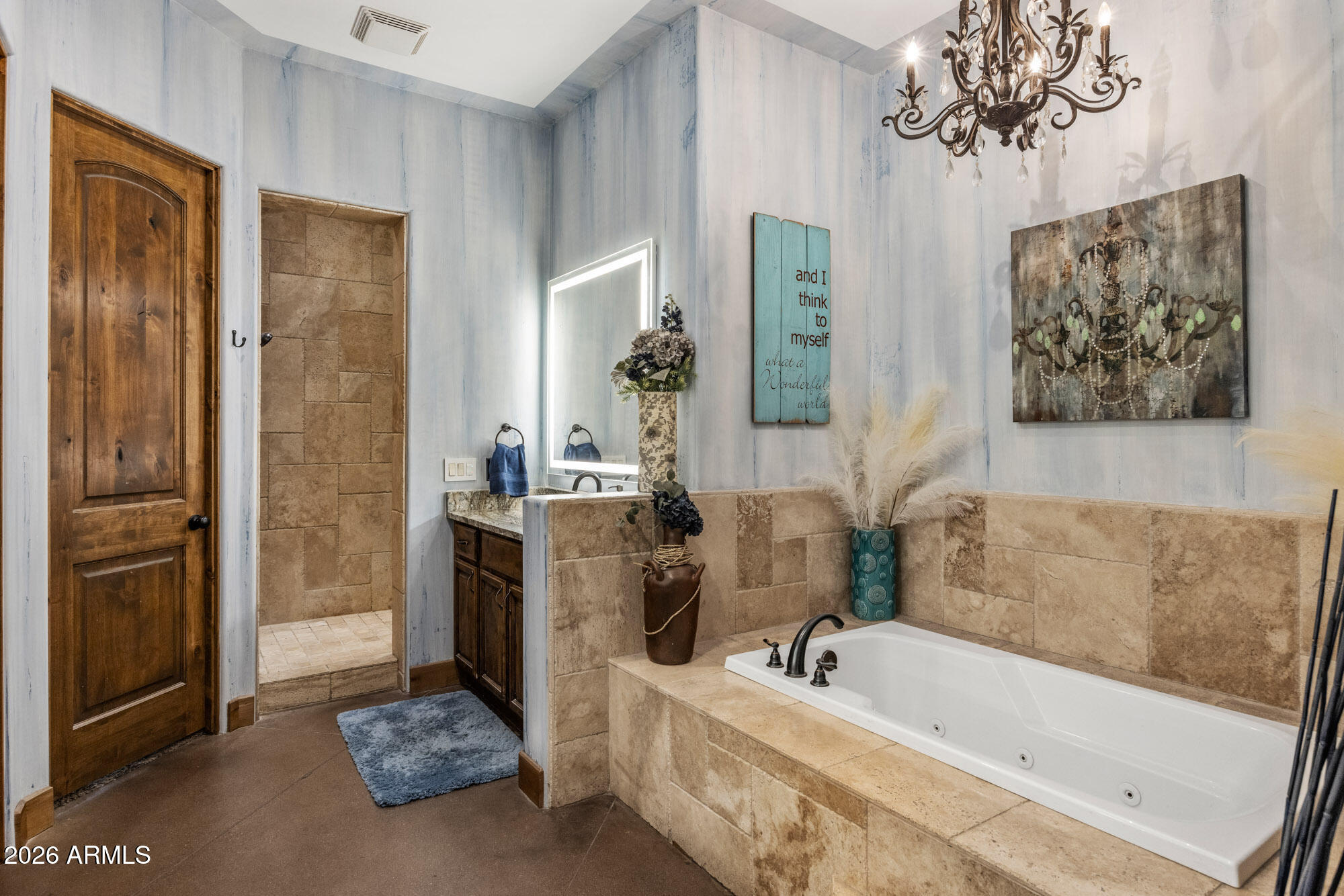 1406 West Joy Ranch Road Phoenix, AZ 85086 - Photo 29 of 58 a bathroom with a tub sink and mirror