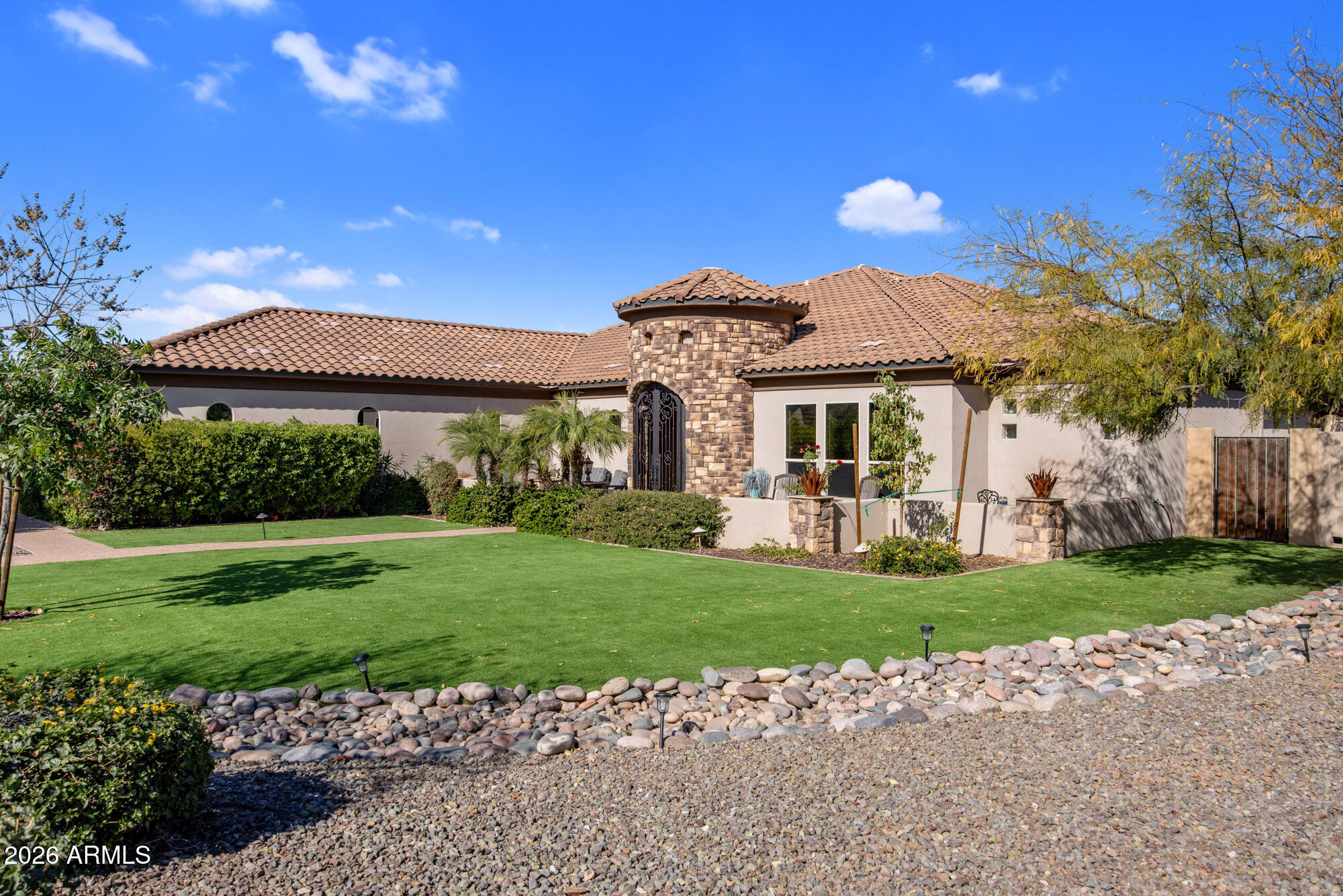 1406 West Joy Ranch Road Phoenix, AZ 85086 - Photo 3 of 58 a front view of a house with a yard